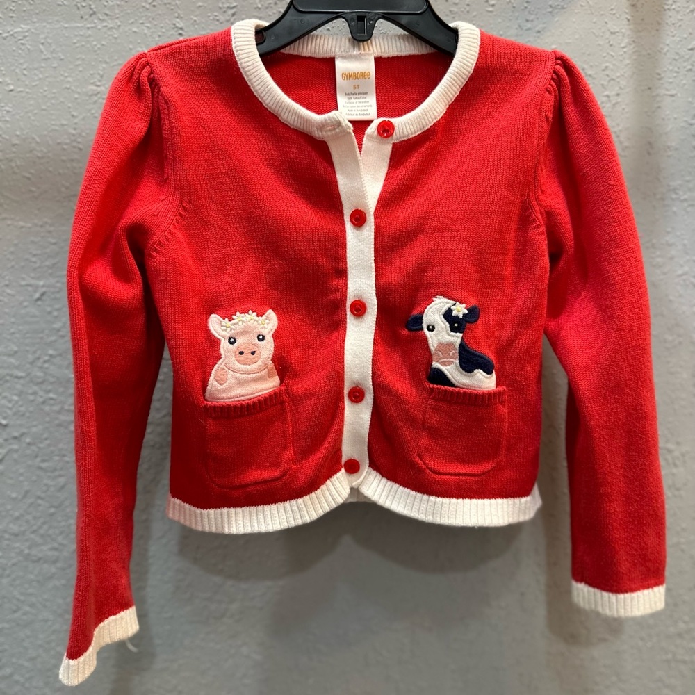 Unisex button down sweater with farm animals, pig and cow, on front pockets.